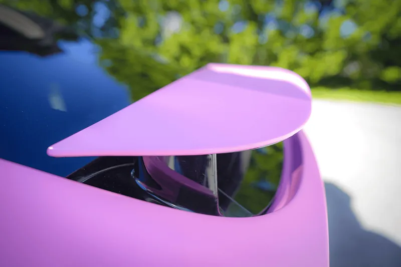 Close-up of a pink wrapped falcon-wing door edge