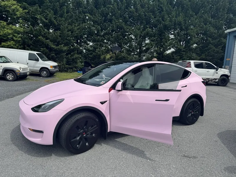 Tesla Model Y wrapped in satin pink